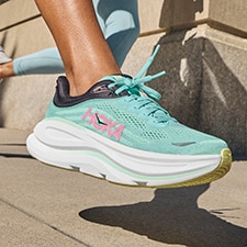 woman running in hoka bondi 9, close up of mesh upper
