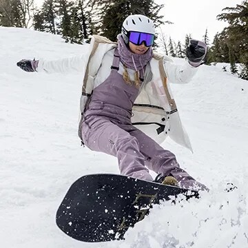 Woman snowboarding.