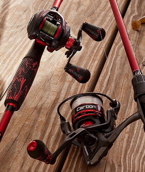 Two Lew's Carbon Fire rod and reel combos on a wooden floor.