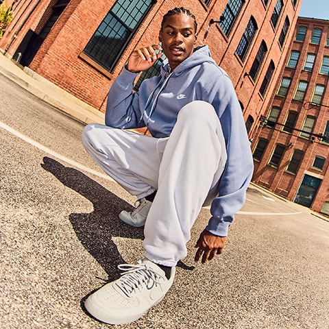 A man posing in the city.