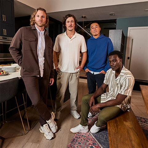 A group of men in a dining room.