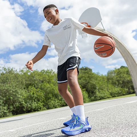A boy playing basketball.