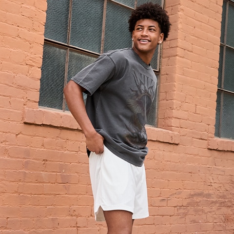 Man wearing shorts and a tee.