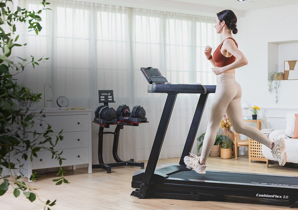 A woman walking on a treadmill