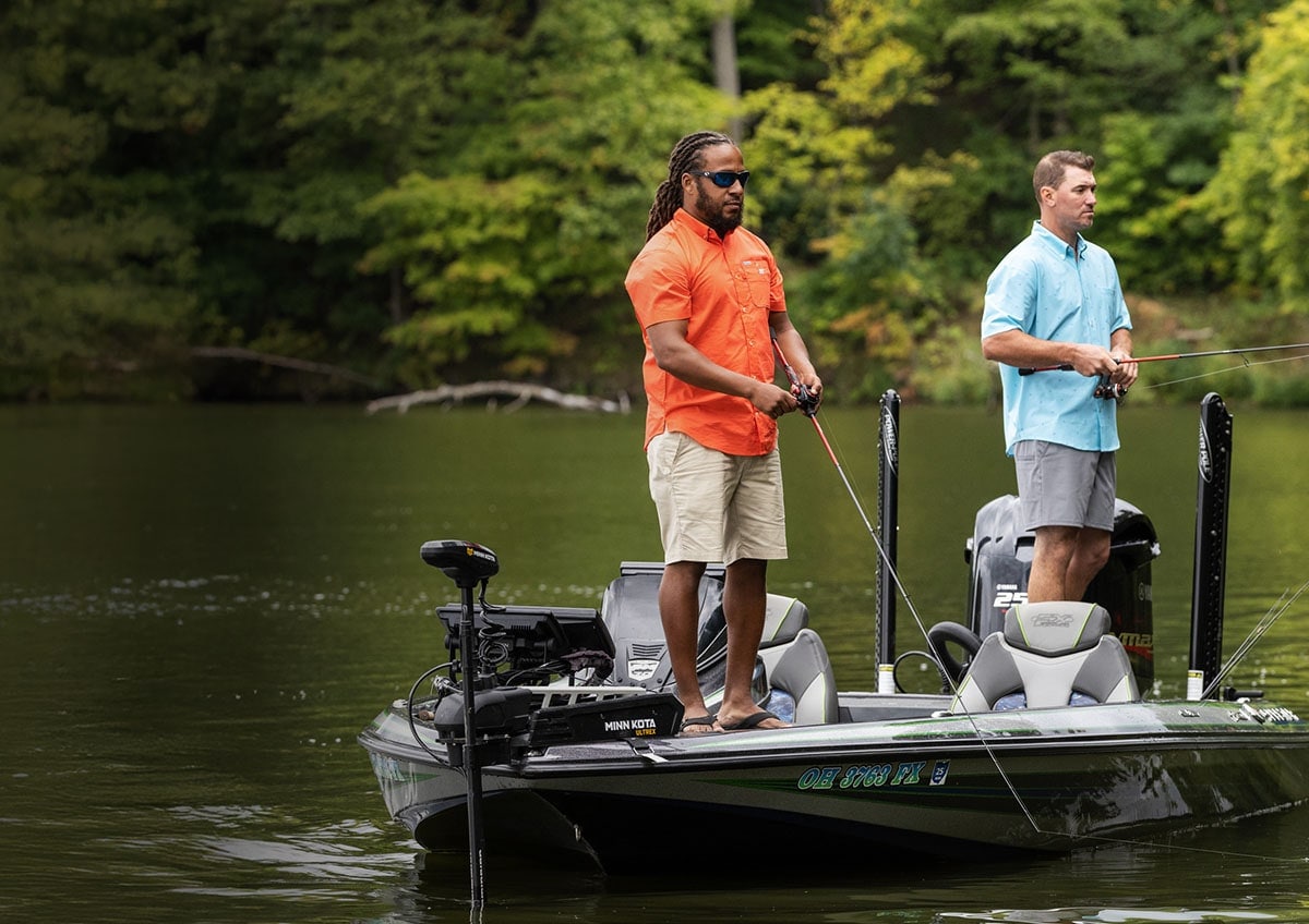 Two fishermen on a boat.