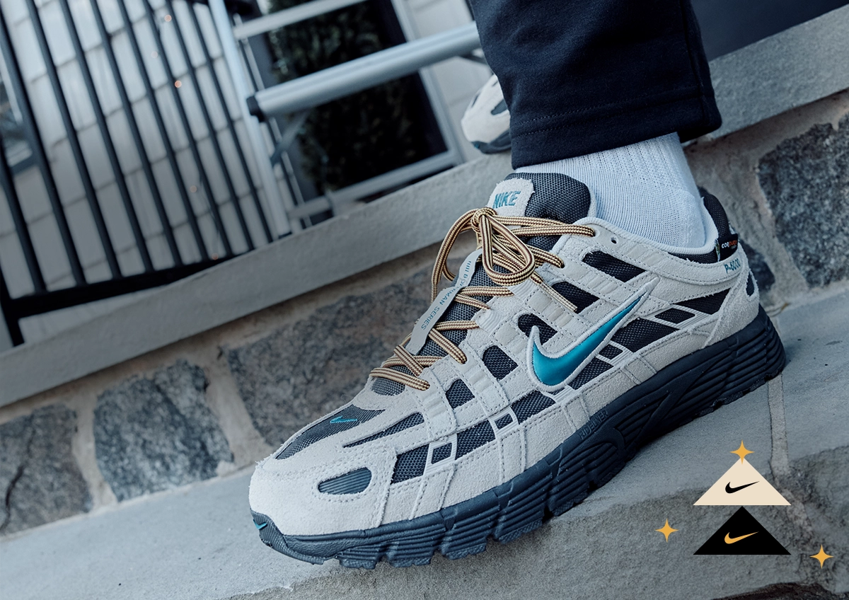 Close up of man wearing Nike shoes.