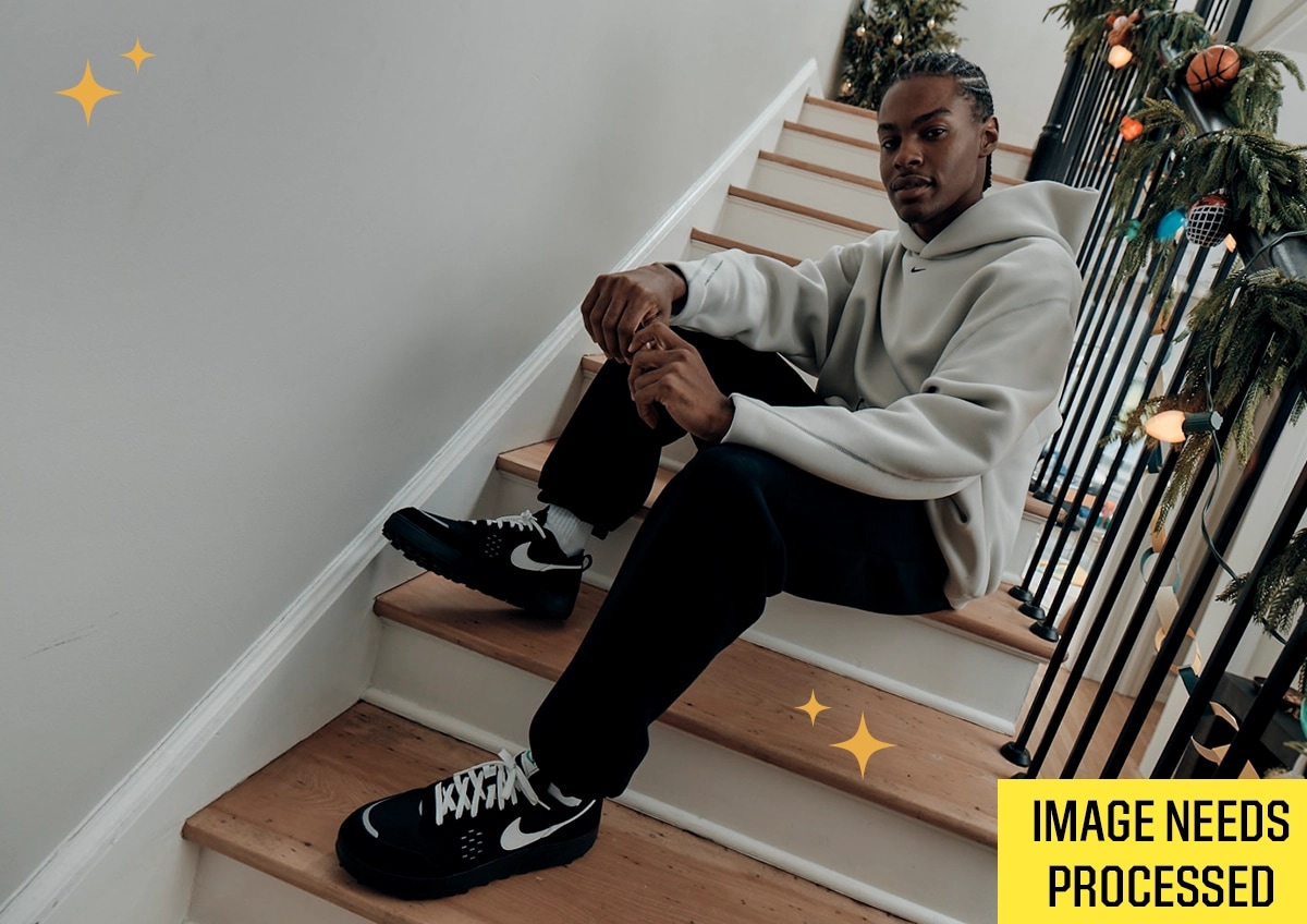 Tis the Season graphic on an image of a man in head to toe Nike outfit.