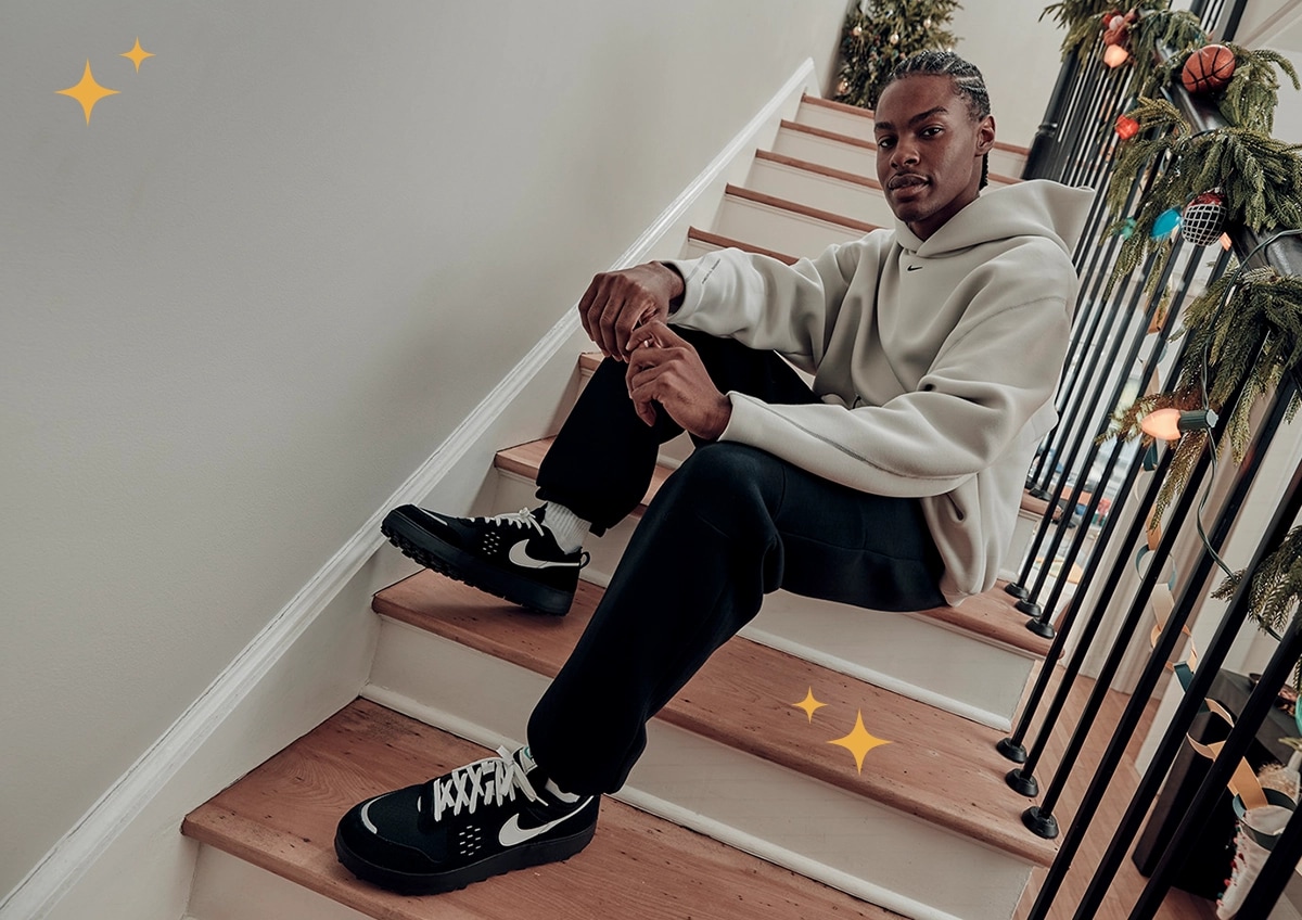 Tis the Season graphic on an image of a man in head to toe Nike outfit.