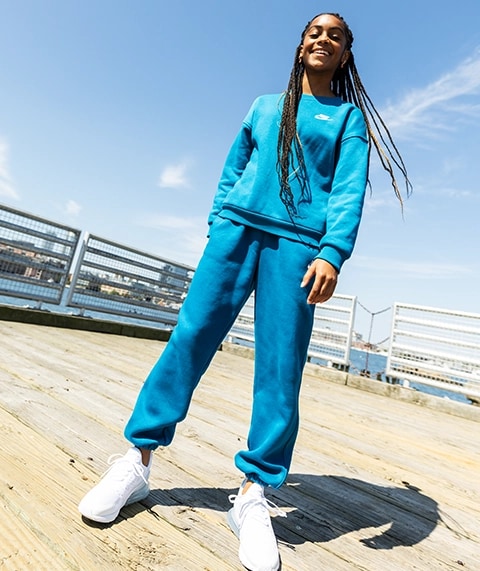 Girl standing outside.