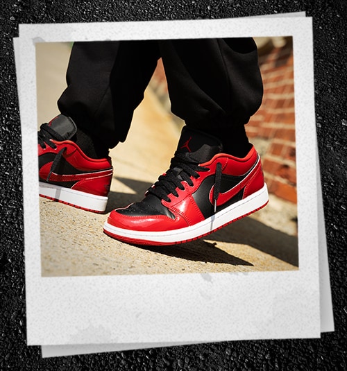 Red and black Nike Jordan shoes.