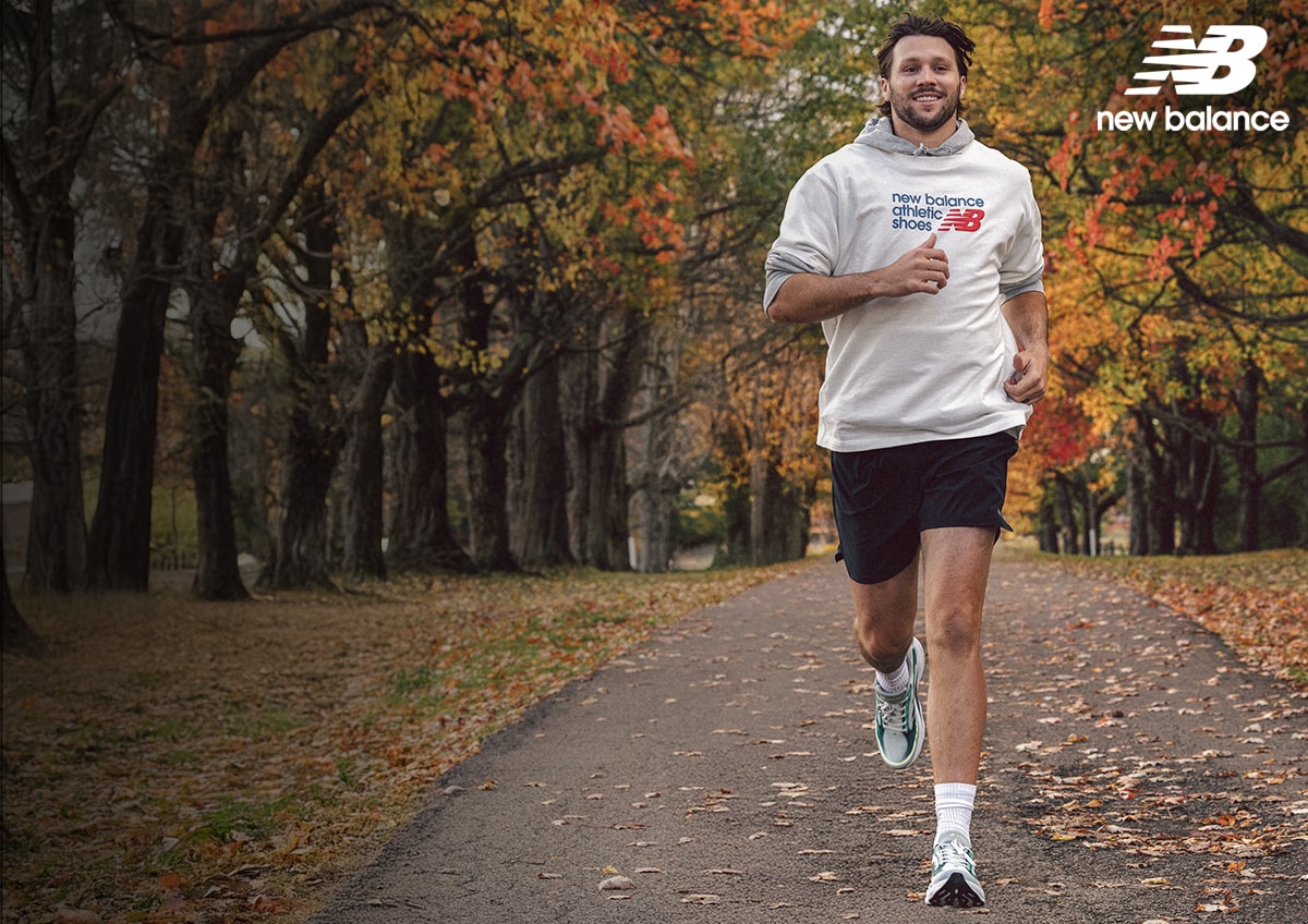 Athlete Josh Allen running in New Balance shoes.