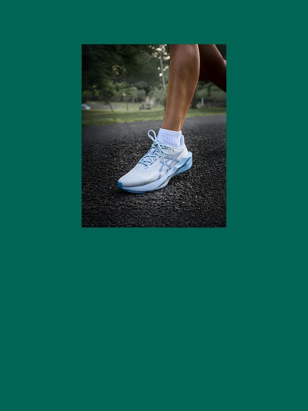 White ASICS running shoe.