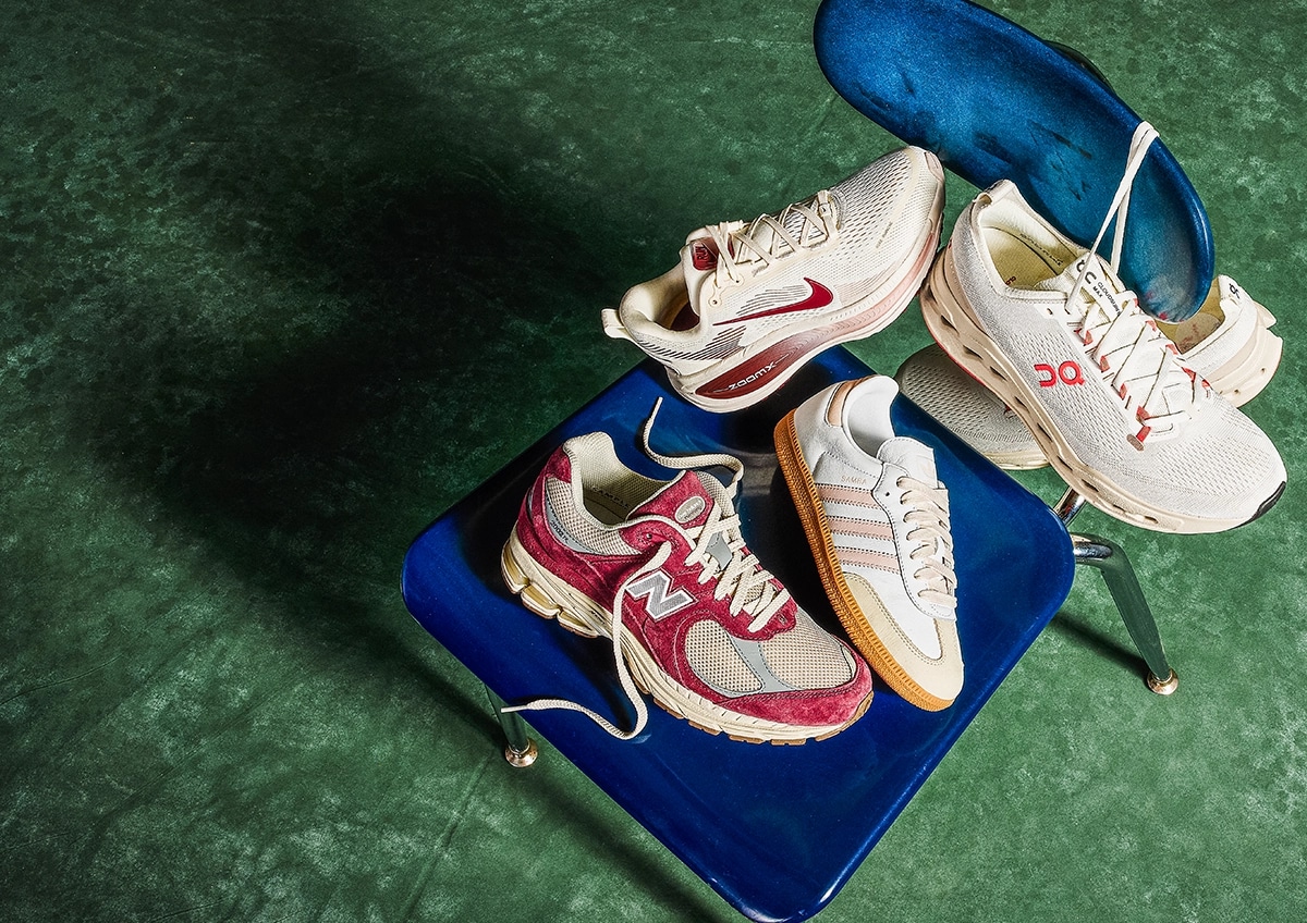 Collection of shoes from top brands on a school desk.