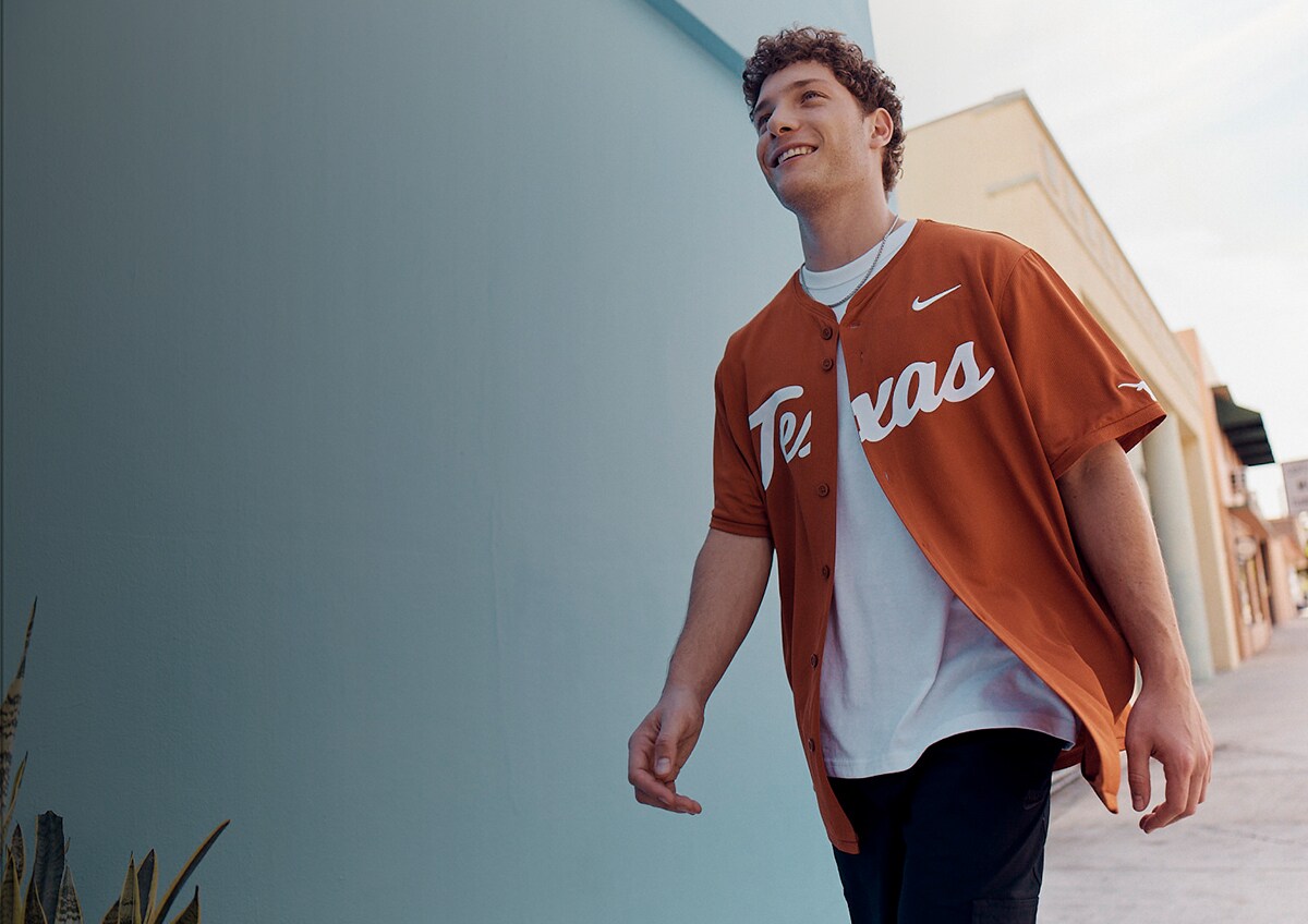Image shows model in baseball jersey