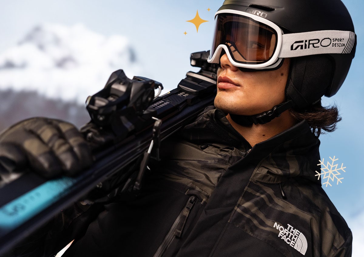 Snowboarder wearing a snow helmet and goggles.