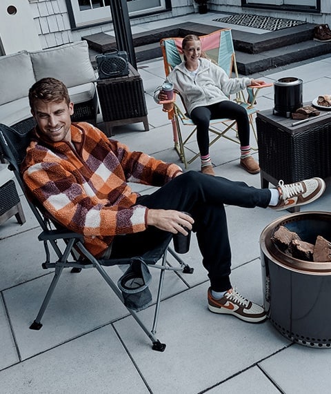 Father and daughter hanging out on a patio.