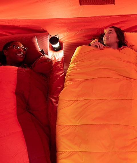 Two people in a tent.