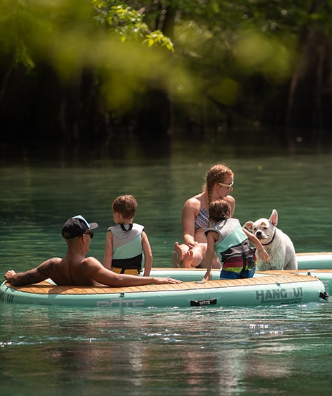 People hanging out on the water.