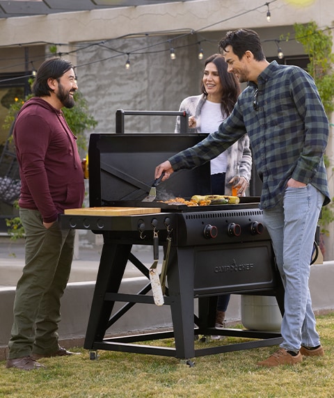 Camp Chef grill flat top in a backyard.