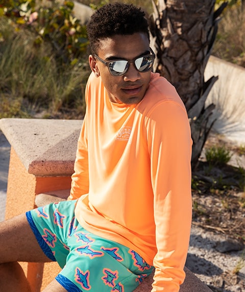 A man wearing a sun shirt