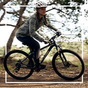Woman riding a bike.