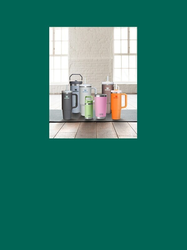 Stanley drinkware on a yoga mat.