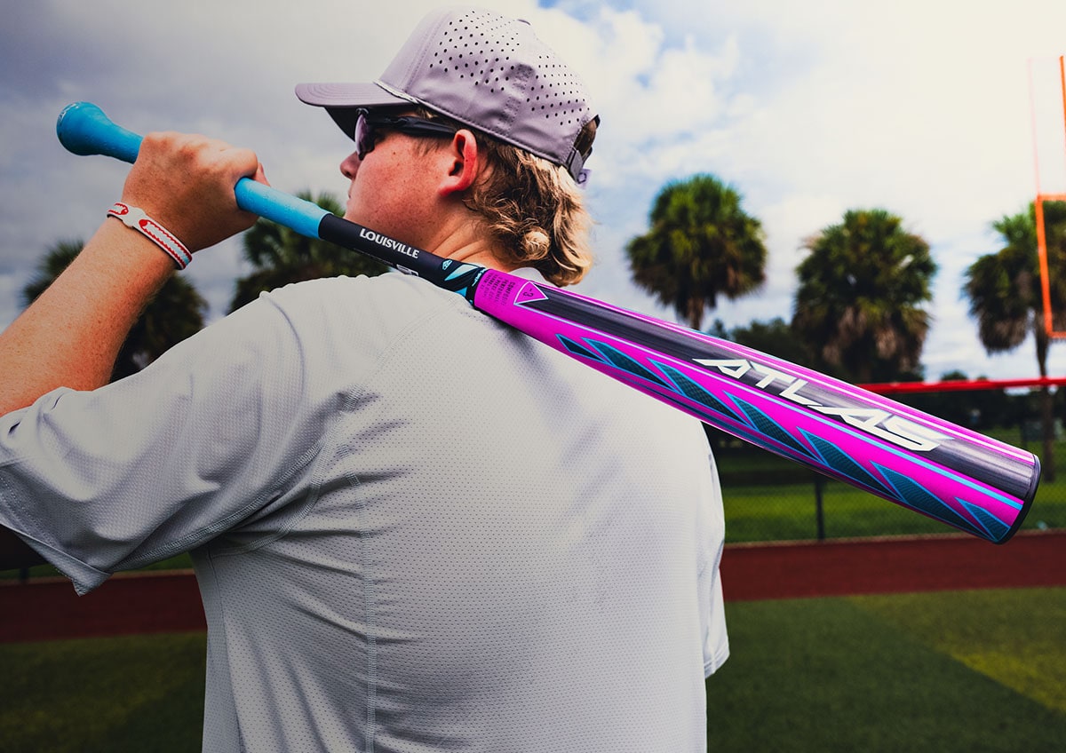 Baseball player with purple bat.
