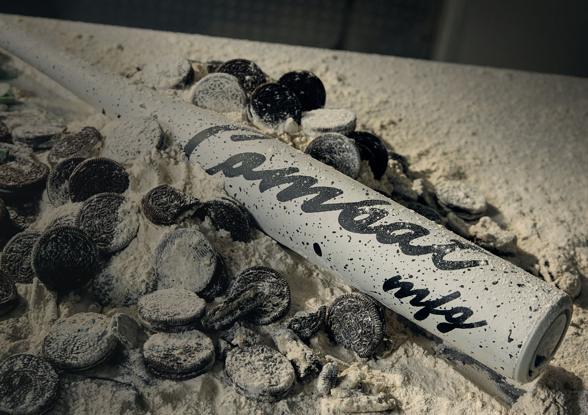 Cookie themed baseball bat on cookies.