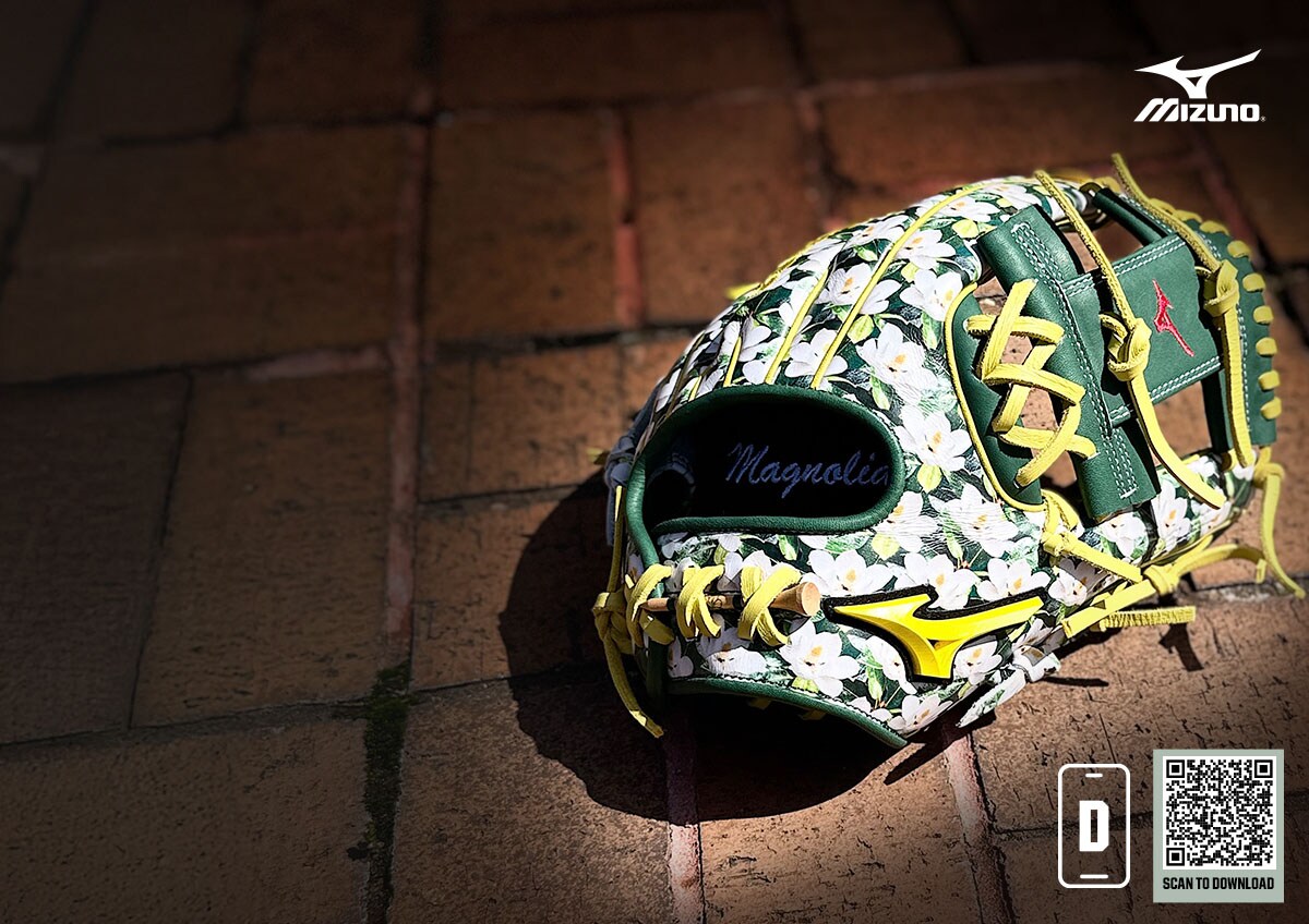 Green, yellow and white baseball glove with flower pattern. Mizuno logo. Scan to download app.