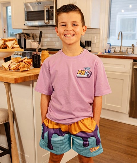 Boy wearing peanut butter and jelly themed Baseball Lifestyle 101 gear.
