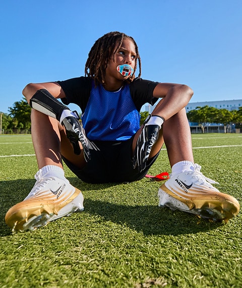 Youth wearing Nike football gear.