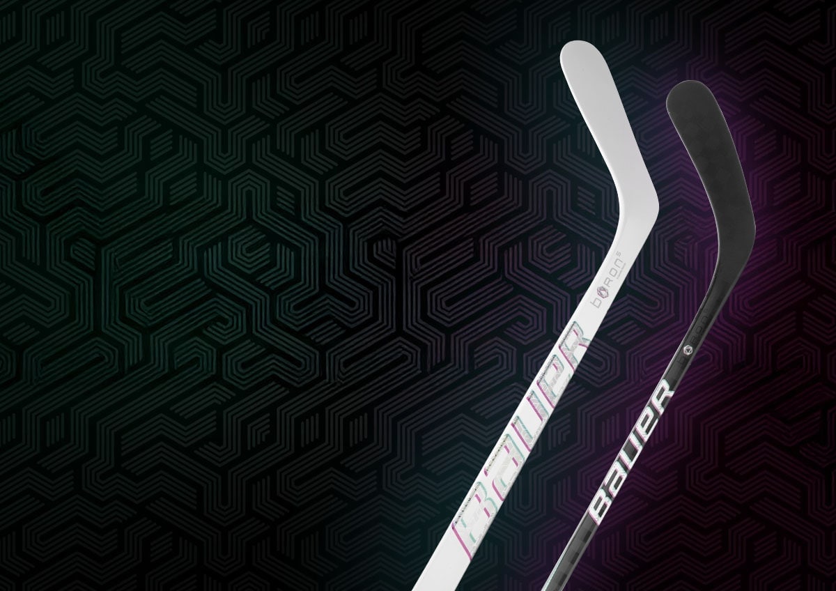 Two hockey sticks on a patterned background.