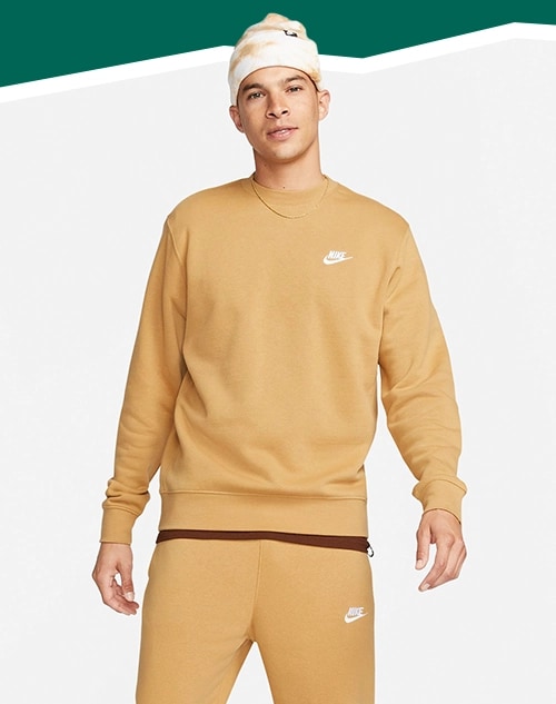 Man standing in sweatshirts.