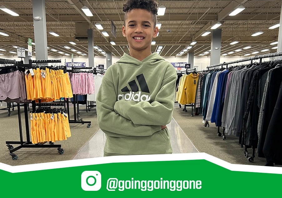 Boy in a Going Going Gone store.