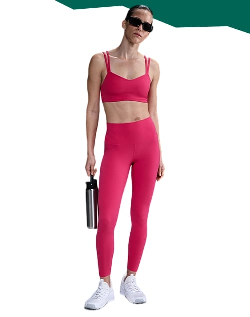 Woman standing in matching leggings set.