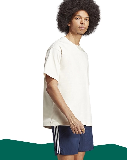 Man standing in shorts.