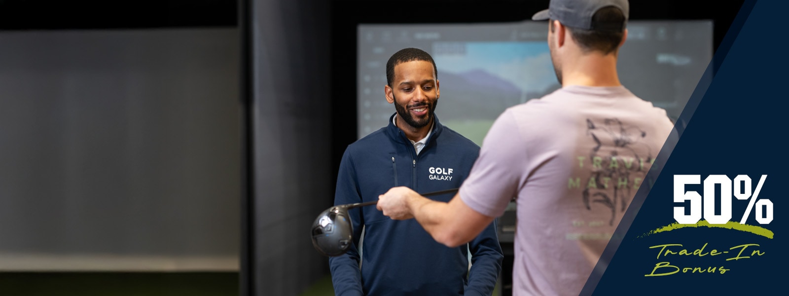 Image features a golfer swinging a driver.
