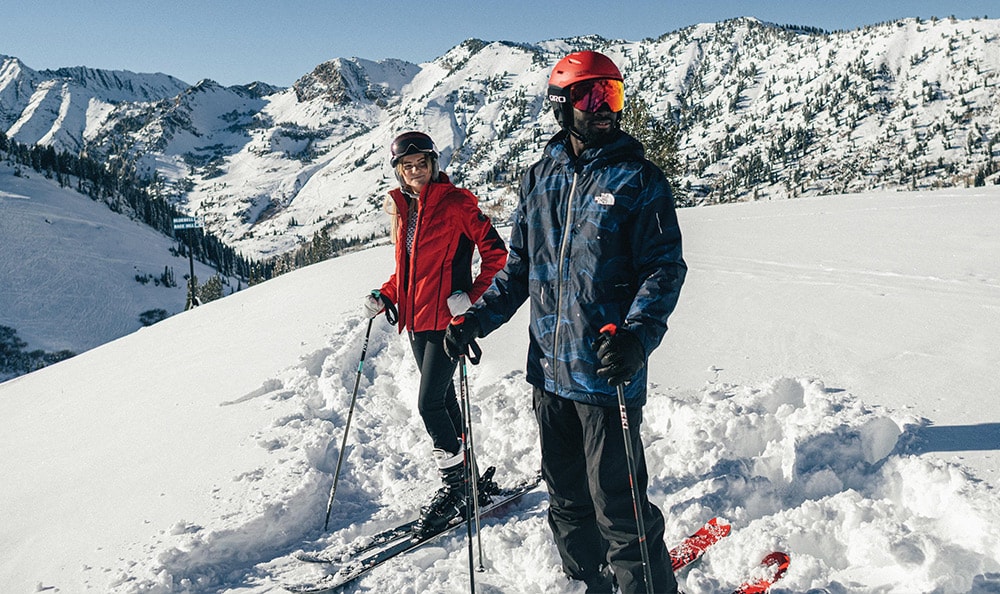 Two skiers on snowy mountain.