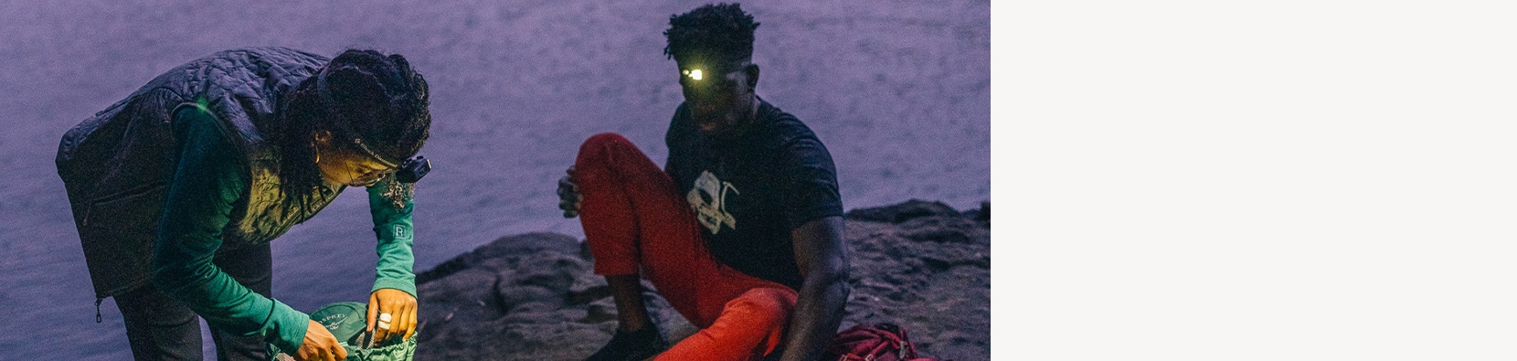 people looking in packs wearing headlamps