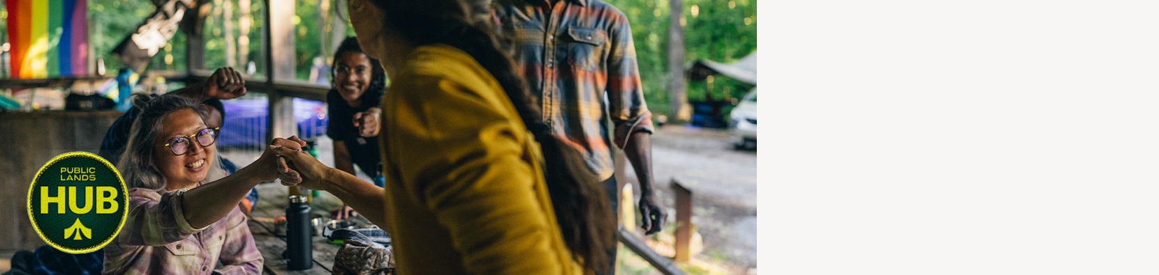 two people doing a handshake outdoors