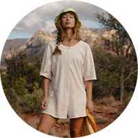 A woman wearing a FP Movement onesie.