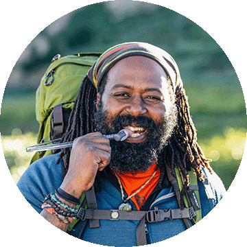 A man drinking from a hydration pack