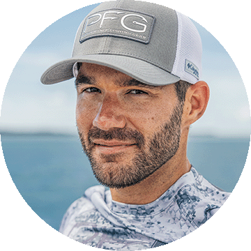 A man wearing a Columbia PFG hat