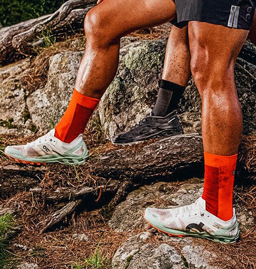 A man walking on a forrest trail