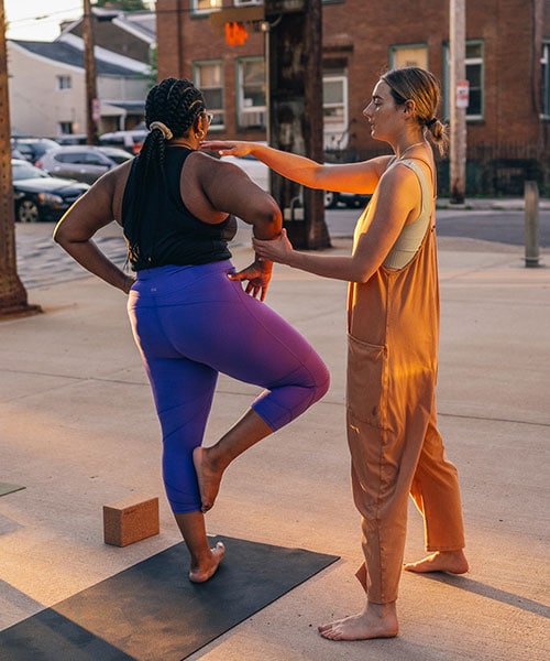 women practicing yoga