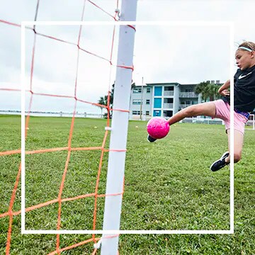 Image of athlete kicking ball into goal