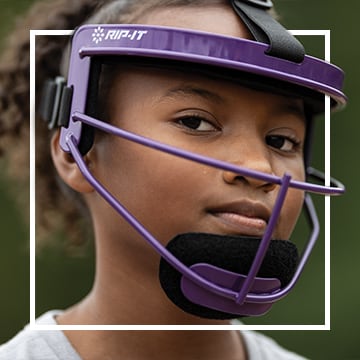 Image of three softball players in the infield