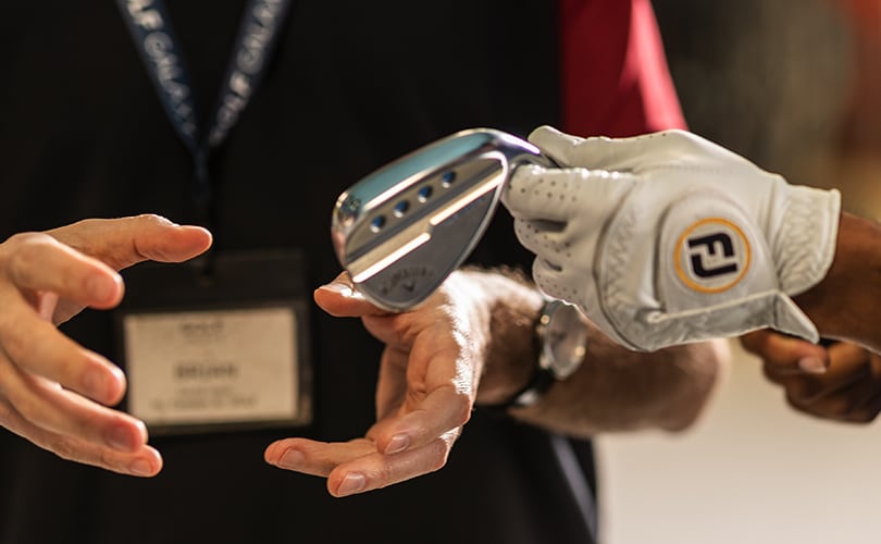 A Golfer Holding A Wedge